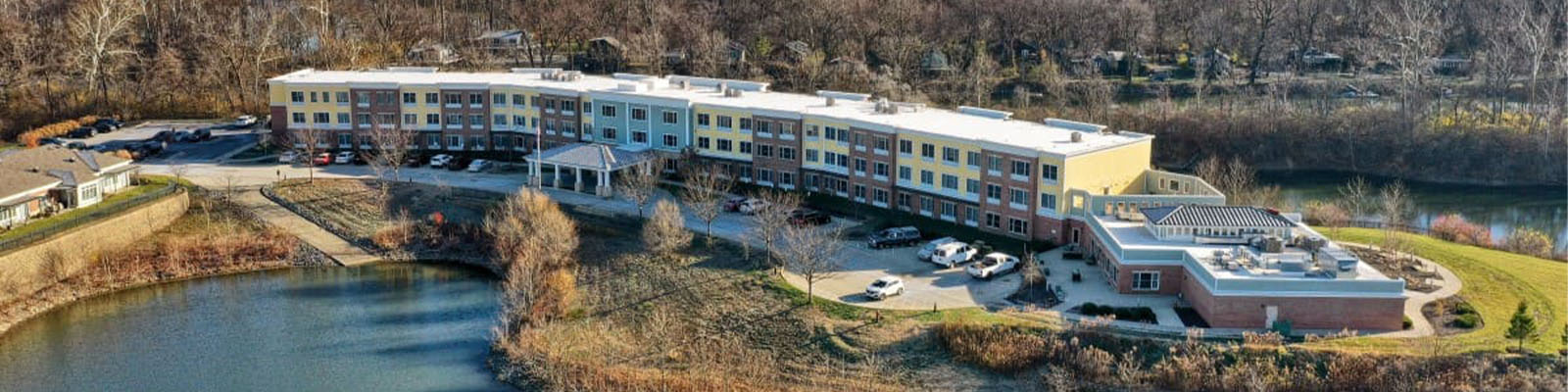 Aerial view of the Traditions at Solana senior living community beside a lake